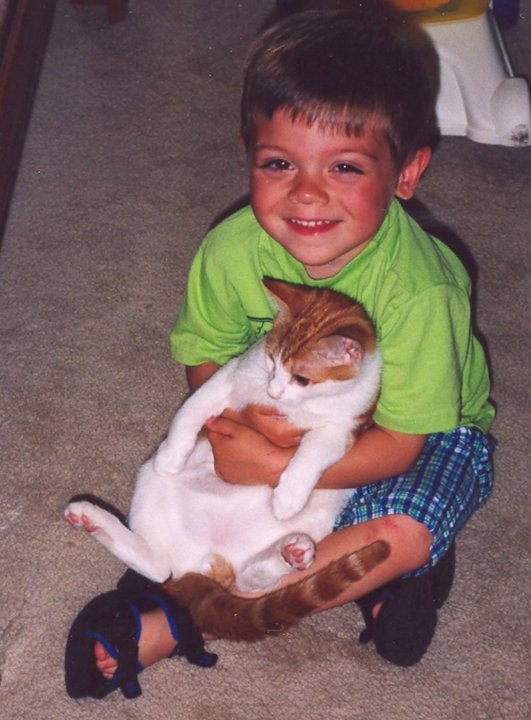 Our son giving our cat Velcro a hug. Our on is now 16 and our cat is 14+ years old. Time sure does fly...