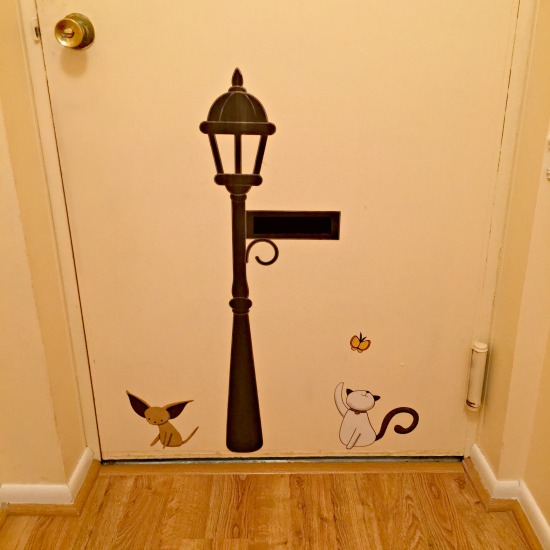 Back of front door - I covered up our family name which was personalized on the lamp sign.