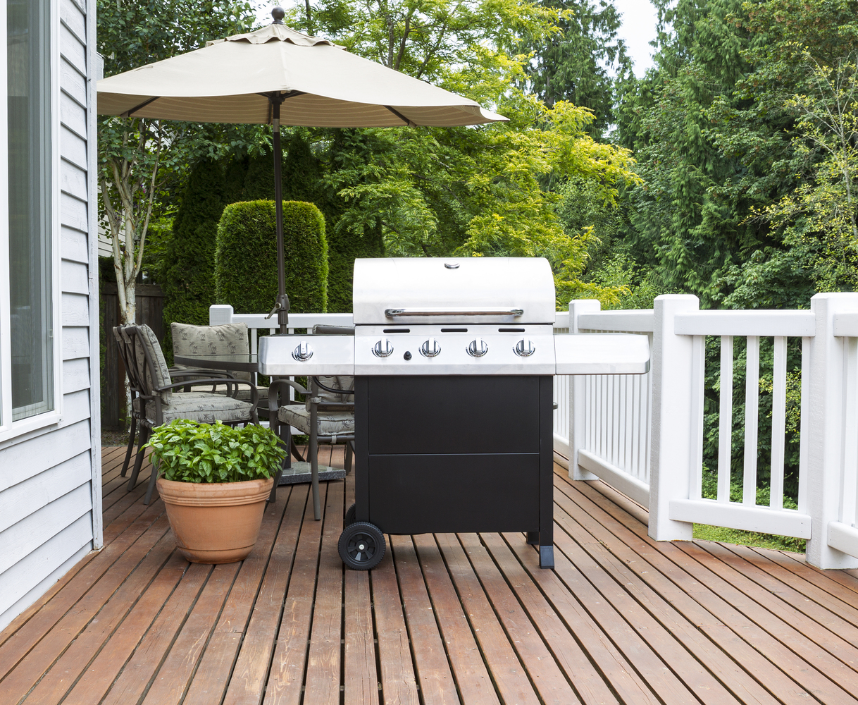Large barbecue cooker on cedar deck
